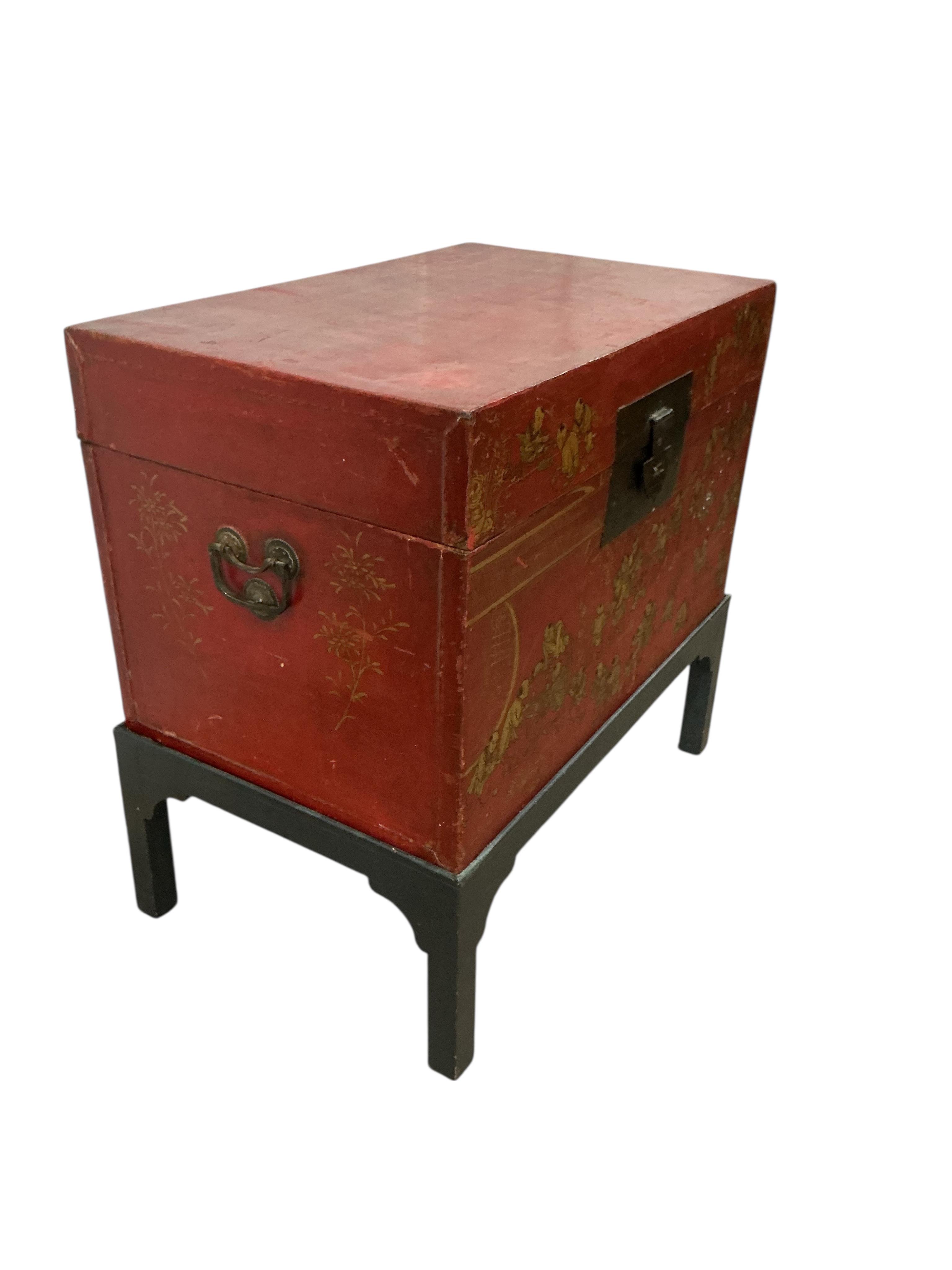 A Chinese scarlet lacquer trunk on stand, width 83cm, depth 53cm, height 84cm